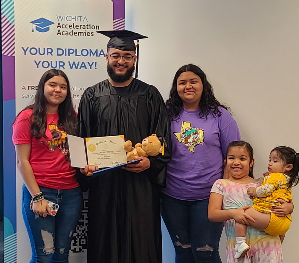 For Wichita’s First Grad, A Long Journey — and Worth Every Mile Hero Image