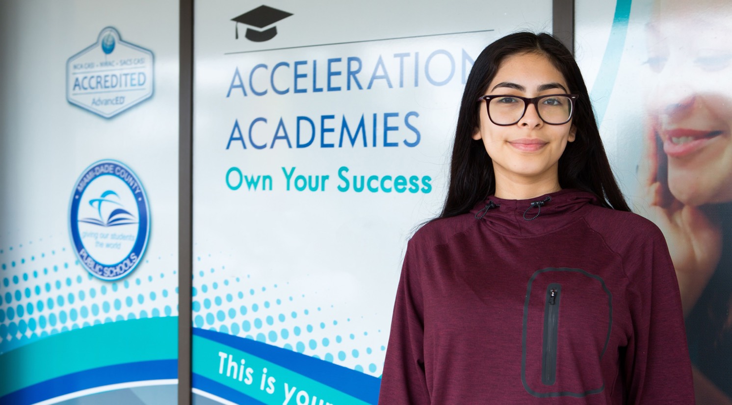 Acceleration Academies Student in front of building