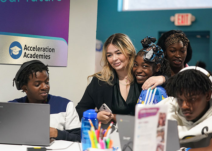 Two female high school graduates at Acceleration Academies.